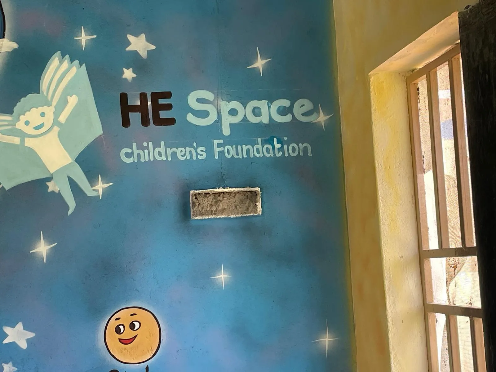 Our HESCF logo on the school wall