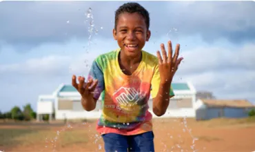 picture showing boy playing with water